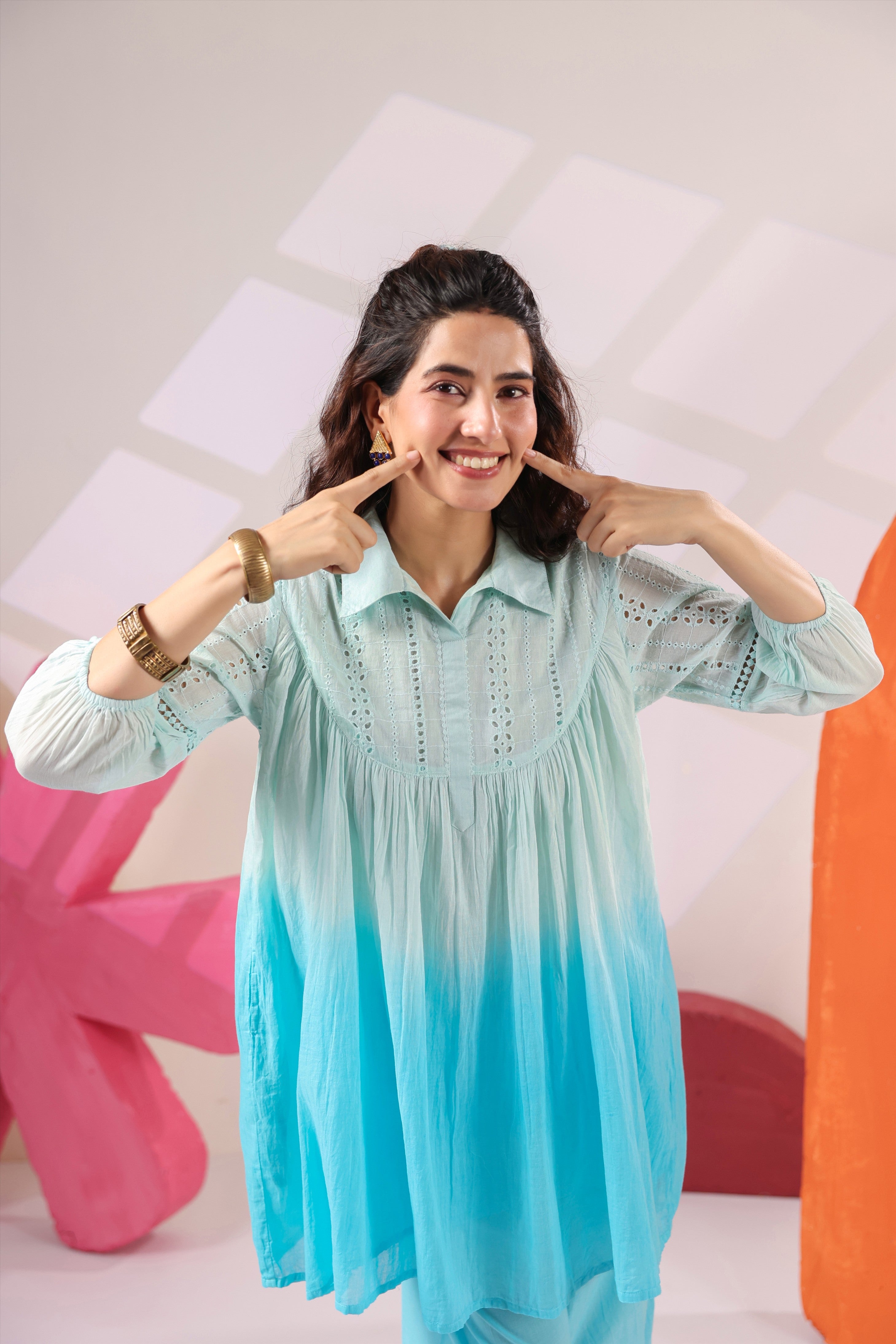 Woman wearing a premium sky blue ombre cotton co-ord set featuring a relaxed-fit tunic with lace detailing, shirt collar, three-quarter sleeves, and matching straight-fit pants, perfect for casual and summer wear.